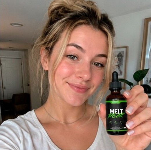 MeltPeakDrop customer holding a bottle, photo 3