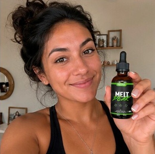 MeltPeakDrop customer holding a bottle, photo 7