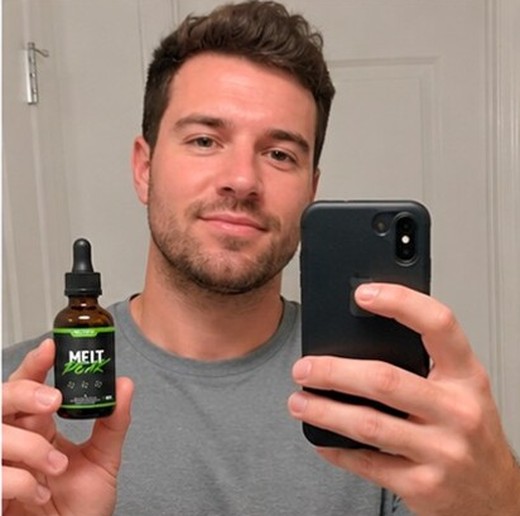MeltPeakDrop customer holding a bottle, photo 8